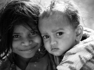Black-and-white close-up portrait of two children