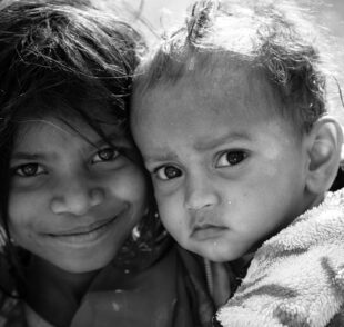 Black-and-white close-up portrait of two children
