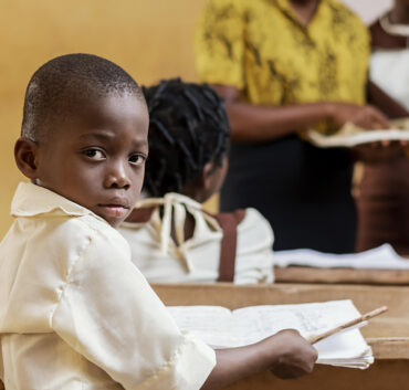 Young student at desk in classroom