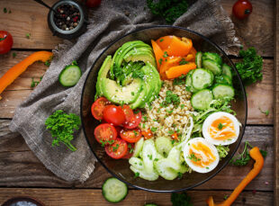 Colorful Buddha bowl with avocado and eggs