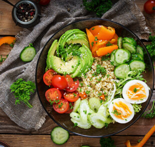 Colorful Buddha bowl with avocado and eggs